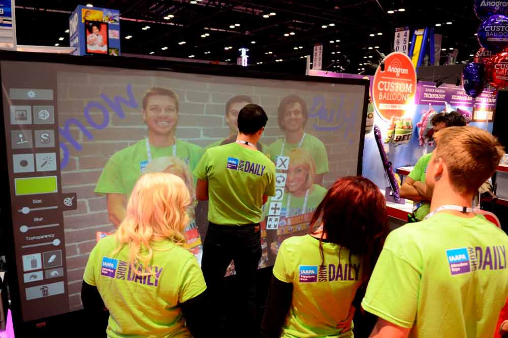 Attendees engaging with a branded MMI Events Live experience at a conference
